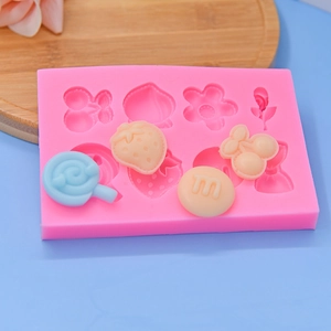 Pink silicone mold with cherry and flower shapes for DIY cake and craft baking