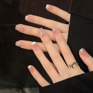 Handmade press-on nails with cat-eye crystal, hand-painted butterflies, and pearls