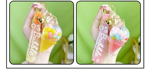 Detail showing colorful ice cream liquid keychains with gradient silicone bubble straps