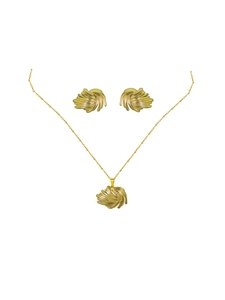 Detailed view of golden jewelry set featuring creative leaf textured necklace and earrings