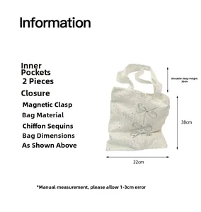 Detailed view of white sequined chiffon tote bag with silver bows and magnetic closure