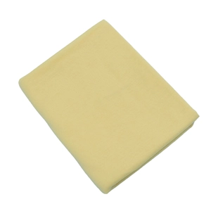 Close-up of yellow jersey cotton fabric texture with soft folds and high-quality weave