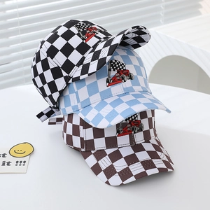 Close-up of checkered baseball caps with racing car embroidery in three colors