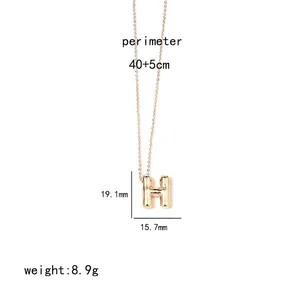Detailed size view of gold H-letter pendant necklace with measurements 19.1mm by 15.7mm