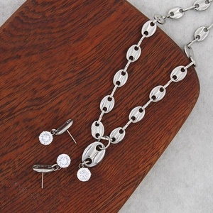 Detailed set of silver steel coffee bean necklace and stud earrings with zircon stones