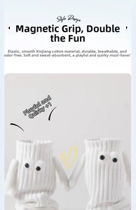 Detail of white cotton magnetic hand-holding socks with 3D eyes and breathable ribbing