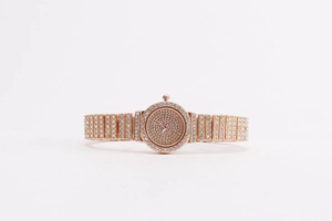 Detail of rose gold crystal-encrusted watch with sparkling rhinestones on band and dial