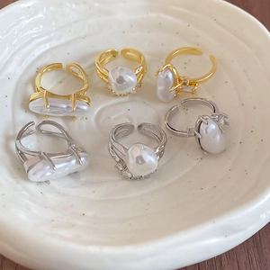 Baroque irregular pearl ring set in gold and silver finish with adjustable open bands