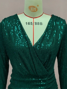 Detail of V-neck wrap dress with high-density dark green sequins and long sleeves