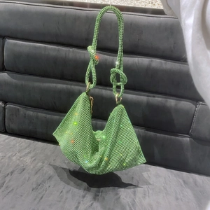 Sparkling green rhinestone handbag with unique knotted handle and gold metal hardware