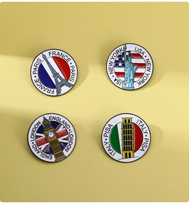 Detailed set of four enamel pins featuring world landmarks in round metal badge design