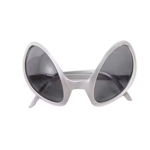 Close-up of silver alien sunglasses with dark lenses for futuristic party costumes
