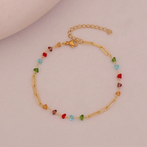 Detailed macro view of the golden chain anklet with colorful crystal beads and lobster clasp