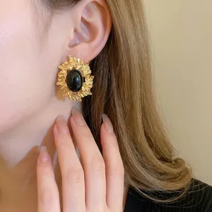 Vintage gold oval leaf earrings with black onyx gemstone in French baroque court style