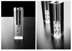 Macro shot of minimalist acrylic vase with bubbles in artistic monochrome cube design
