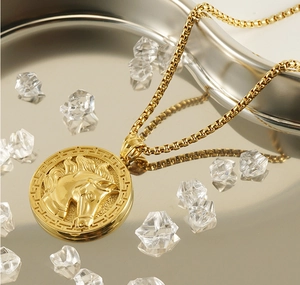 Macro shot of 3D horse head relief pendant on gold chain with crystal stone styling