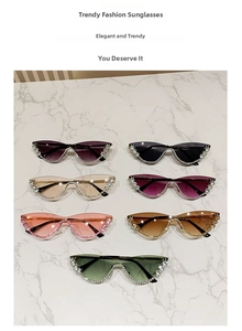 Close-up of cat-eye sunglasses with rhinestone-embellished frames in multiple lens colors