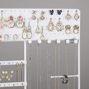 White metal jewelry display stand with wooden base for earrings and necklaces