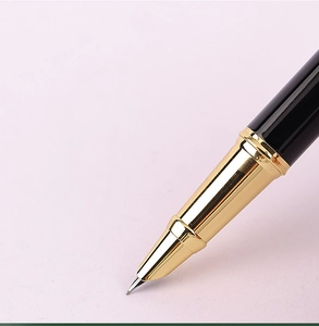 Close-up of elegant black and gold metal business fountain pen with detailed nib