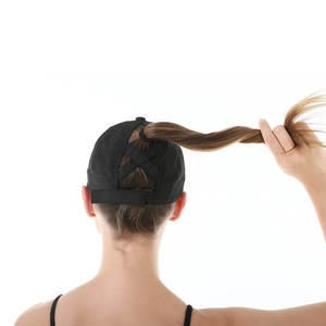 Detail of black ponytail baseball cap with criss-cross elastic back and mesh panels