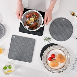 Gray silicone heat resistant mats in square and round shapes with wave texture
