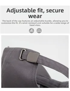 Detail of adjustable metal buckle and cotton strap on a grey baseball cap for custom fit
