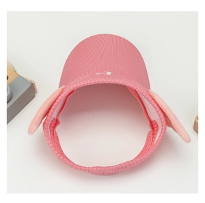 Close-up of pink knit kids visor with cute plush ears and wide sun protection brim