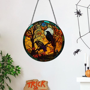 Detail of Halloween window hanger featuring crows and castle on a round acrylic plate