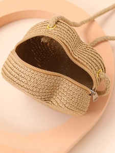 Miniature heart-shaped straw bag in natural brown with rope strap for summer beach vacation