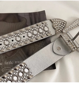 Detailed view of silver Y2K punk belt featuring sparkling rhinestones and metal studs