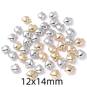 Detailed view of silver and gold heart pendants in 12x14mm size for DIY jewelry making