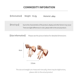 Detailed spec sheet showing rose gold alloy bow earrings dimensions and 15.2g weight