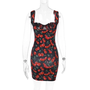 Detailed view of black slim-fit mini dress with elegant red cherry print pattern