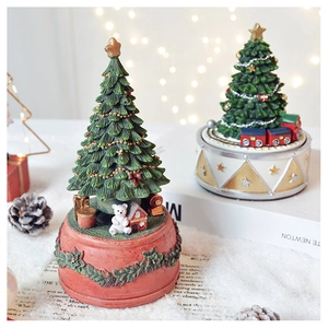 Classic rotating Christmas tree music box with festive bear and train figurines