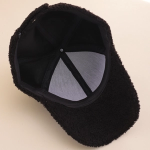 Detail view of the black sherpa baseball cap interior showing lining and sweatband