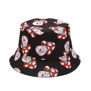 Reversible bucket hat with cute mushroom pattern made of black canvas for sun protection