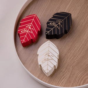 Detailed leaf-shaped paper gift tags with gold foil For You text in red, black and white