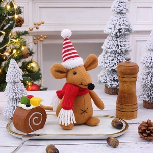 Christmas mouse doll with red striped hat and scarf on cozy festive background