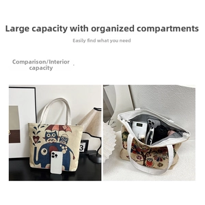 Detailed view of spacious canvas tote interior with embroidery and storage capacity