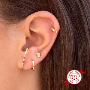 925 Sterling Silver bee stud earrings and gold hoop set worn on ear closeup