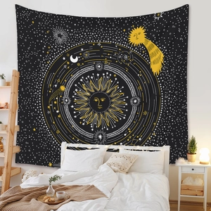 Detail of bohemian mandala tapestry featuring sun and moon celestial pattern in a bedroom