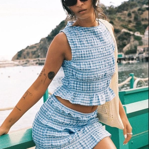 French style blue plaid two-piece set with sleeveless ruched top and mini skirt