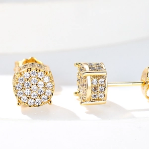 Four-claw gold stud earrings featuring round micro-paved cubic zirconia in a starry design