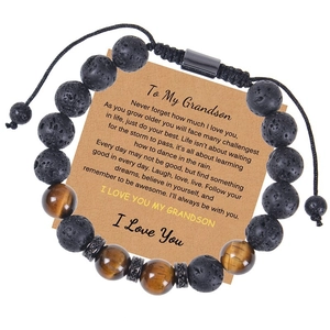 Detailed shot of 10mm tiger eye beads and lava stones with an adjustable cord and gift card