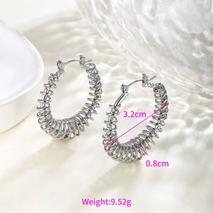 Detail of silver spiral hoop earrings showing 3.2cm diameter and 0.8cm coil thickness