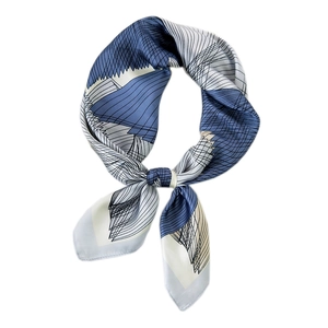 Blue and white geometric silk scarf with abstract lines in a stylish knotted display