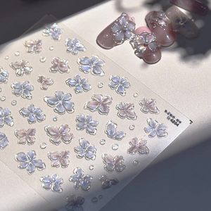 Macro detail of 3D embossed jelly flower nail stickers with iridescent pearl finish