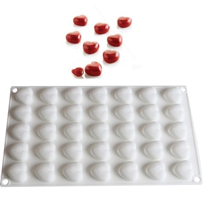 White silicone mold with 24 heart cavities for making chocolate or ice cubes