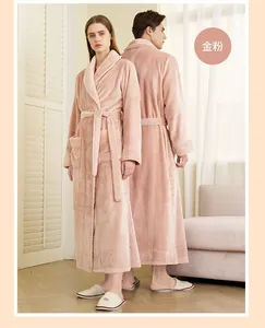 Detail of dusty pink flannel bathrobe featuring dotted collar texture and waist belt