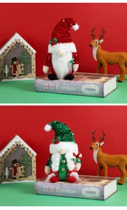 Detail of Christmas gnomes with sequined hats and candy cane decorations for holiday decor